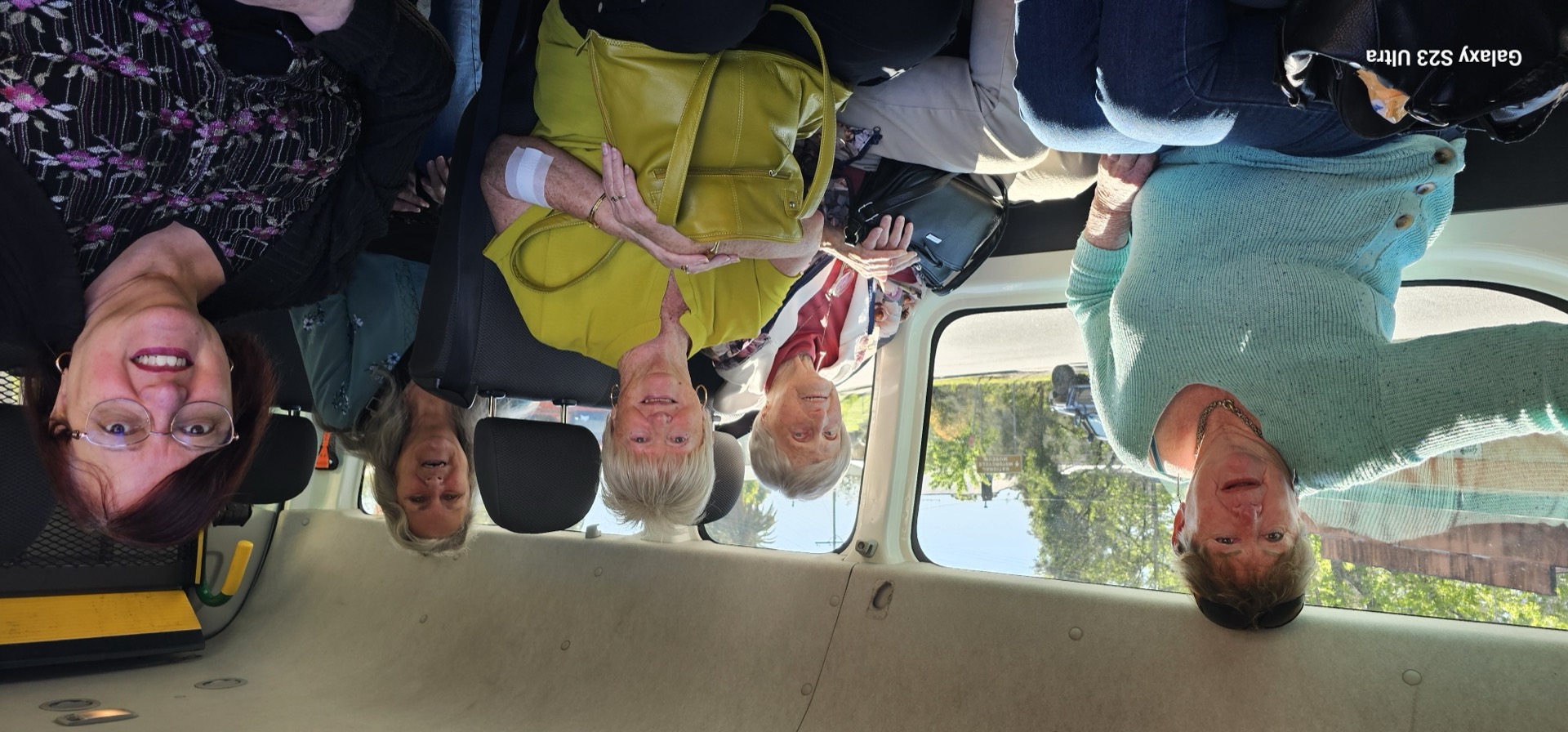 Get Up & Go passengers enjoying a group outing together in the van